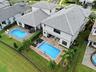 Two-story residence featuring a private pool and extended patio