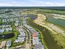 Lakeside property with a private pool and surrounding green space