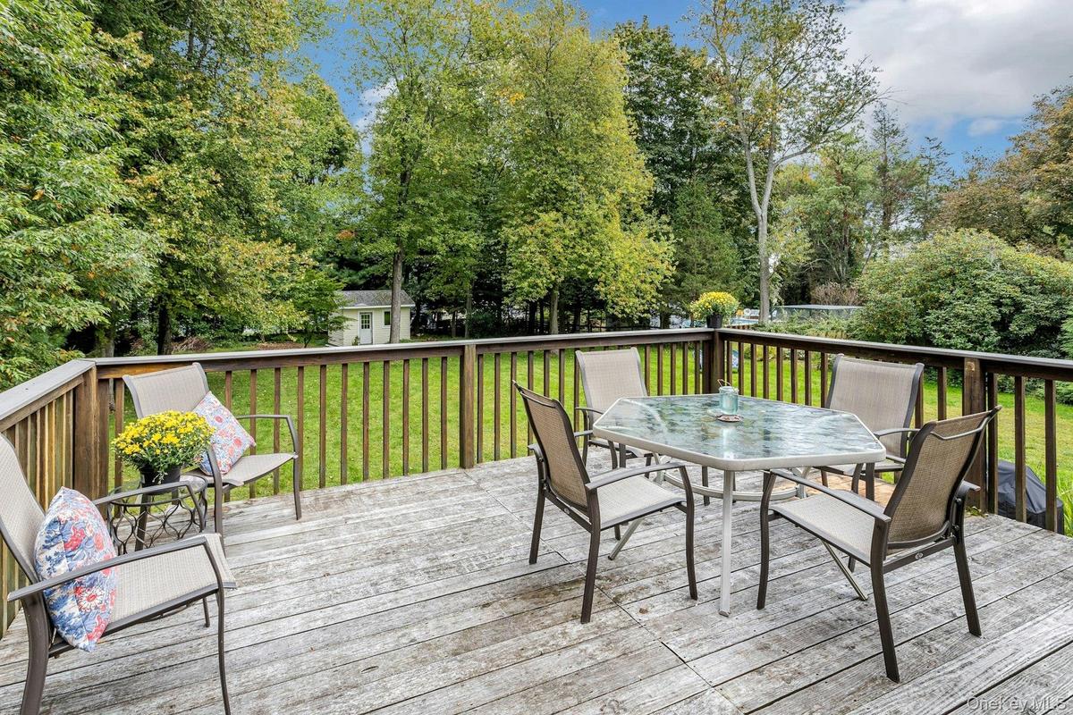Deck overlooking pretty yard