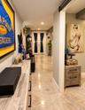 Recessed lighting, light-toned walls, and a barn door entry