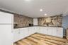 Wet Bar Area with Cabinets for Storage & Frige.