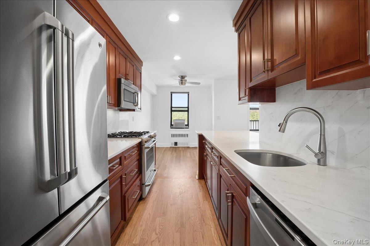 Kitchen also boasts a custom pantry closet.