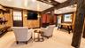 Life is meant to be enjoyed in this incredible walk-out lower level, featuring a stylish bar, cozy fireplace, dedicated game area, and comfortable TV 
