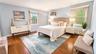 The expansive primary bedroom offers generous closet space and a private en-suite bath, creating a comfortable and inviting retreat at the end of the 