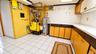The well-maintained mechanical room features a newer oil furnace, hot water heater, and abundant storage space, offering both efficiency and practical