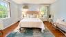 Another beautiful view of the spacious primary bedroom, showcasing its generous proportions and comfortable, inviting atmosphere—perfect for relaxing 