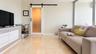 Living Room towards Laundry and Bathroom