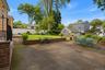 Gracious and welcoming backyard for dining, BBQing, and gardening