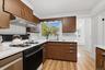 Bright modern Kitchen with picture window looking out into the backyard