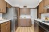 Clean bright Kitchen w/new floors, DW & tons of cabinetry