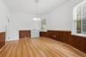 High ceilings, crown moulding, and wood wainscoting in the Dining Room