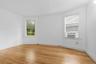 Bedroom with refinished wood floors
