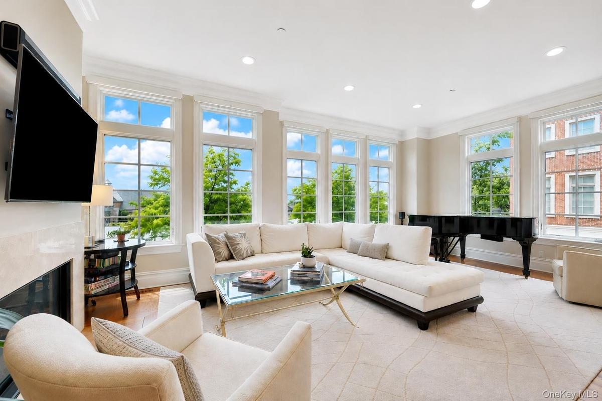 Sprawling and sunny, complete with fireplace and oversized windows that allow for river views