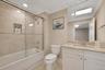 4th floor full hall bath - marble tile and vanity