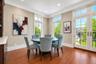 Enjoys oversized windows, Juliet balcony with built in custom cabinetry