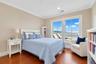 Sun-filled 4th floor bedroom features walk-in closet and river view