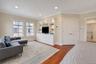 En suite with living area, Hunter Douglas automatic blinds and custom built in cabinetry