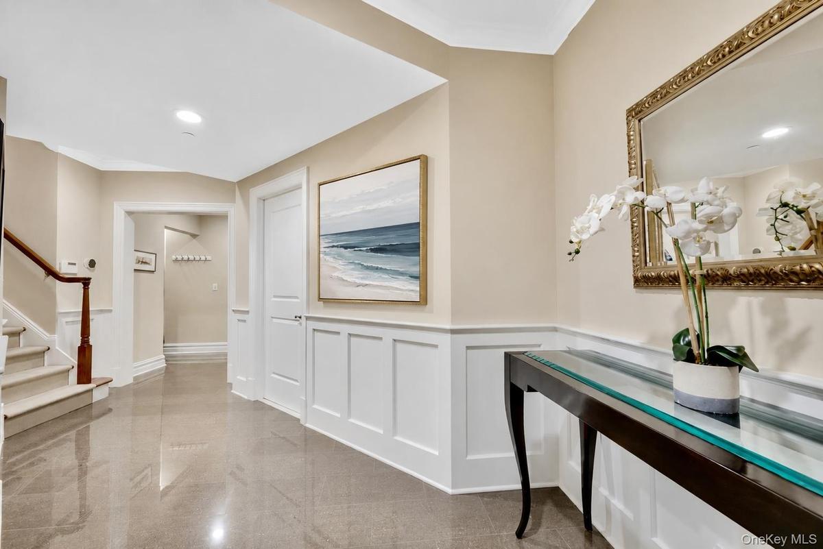 First floor entrance with mudroom, pantry and access to 2 car garage (complete with EV charging)