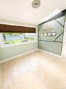 Tile flooring, multiple windows, window blinds, and a skylight
