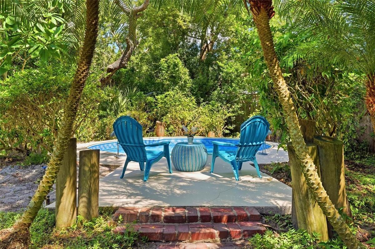 Lush Greenery and a Charming In-Ground Pool