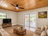 Virtually staged den area off pool area