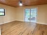 Beautiful wood floors and tongue and groove wood celing