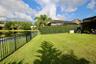 Fenced in yard overlooking Pond