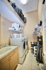 Laundry Room with so much extra space for storage and large tub sink.