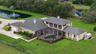 Aerial view looking from the rear of the home