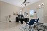 The inlaw suite is currently used as an office.  This room could be the living/dining room, if the conference room is staged as a bedroom