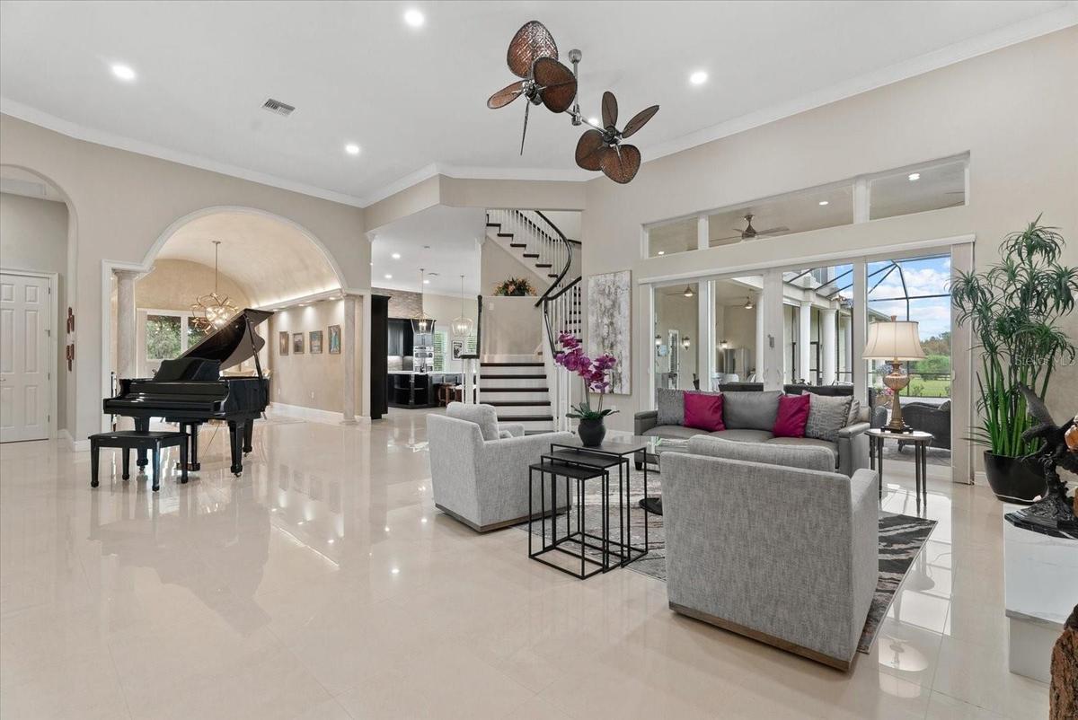 Sparkling tile floors, 12 ft ceilings, crown molding, clerestory windows, a winding staircase and custom wood trim set the tone for this wonderful fro
