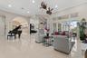 Sparkling tile floors, 12 ft ceilings, crown molding, clerestory windows, a winding staircase and custom wood trim set the tone for this wonderful fro