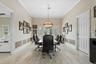 Just beyond the media room is a unique space - a full in-law suite/apartment that would serve many purposes. Thi first room is currently used as a con