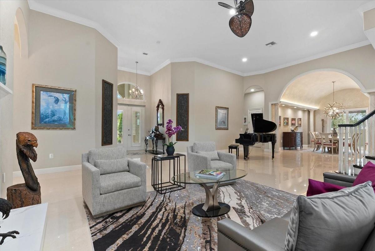 This view back towards the front entryway shows the scope of the large living room