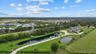 The drone photo gives a nice perspective of the long driveway and two ponds