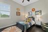 Bedroom four is a cosy space, with hardwood floors, built-in closet and access to the Jack and Jill bathroom