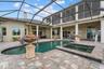 Enjoy the heated spa that spills over into the pool