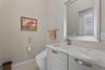 Half bath that leads to the pool deck