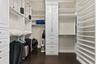 The two walk-in closets feature custom cabinets and shelving
