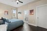 Bedroom five is also upstairs, with a walk-in closet and private ensuite bath