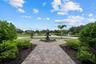 Looking out from the front door towards the large bronze fountain, ponds and driveway