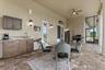 The second outdoor lounge area is off the family room/kitchen area, and offers access to the half bath off the media room