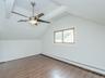 2nd floor: Bedroom #3 showing ceiling fan & window.