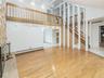 Living room is open to the balcony hallway on the 2nd fl.