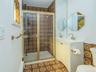 1st floor: Primary bathroom with stall shower and cool 70's tile.
