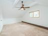 2nd floor: Bedroom #5. Ceiling fan and beams.