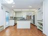 View of the kitchen showing the terracotta floor tile.