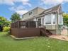 Back deck has door to the kitchen, gas for the grill. A door on bottom of deck leads to Bilco door to basement.