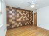 1st floor: bedroom #1 with the wooden inlayed wall.