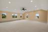 This oversized bonus room opens up a world of possibilities — movie nights, game days, a home gym, or all three.